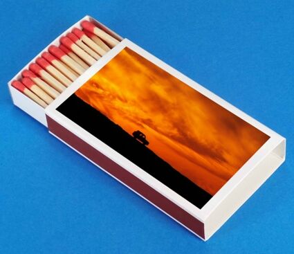 Streichholzschachtel mit aufgeklebtem Ferienfoto.